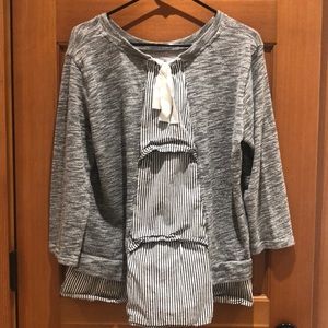 Oversized knit sweater with ruffle back